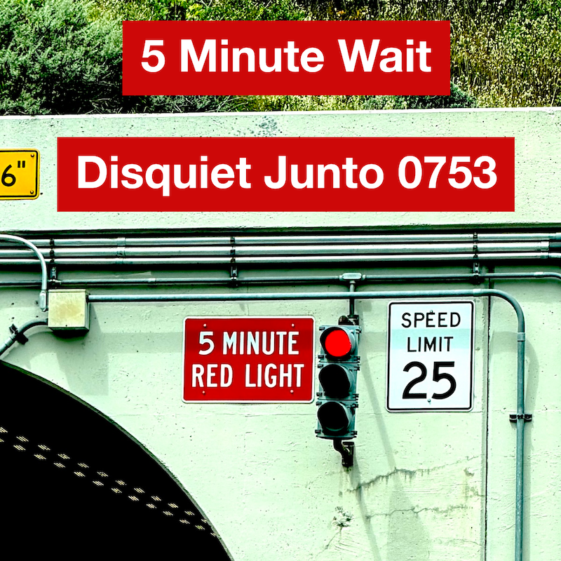 The entrance to a tunnel with a sign that reads "5 Minute Red Light" and another that reads "Speed Limit 25" plus the name and number of the project